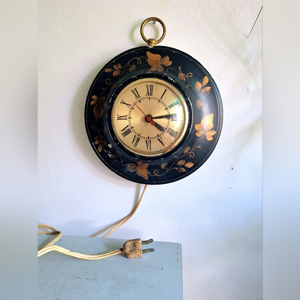 Antique electric wall clock with Roman numerals
